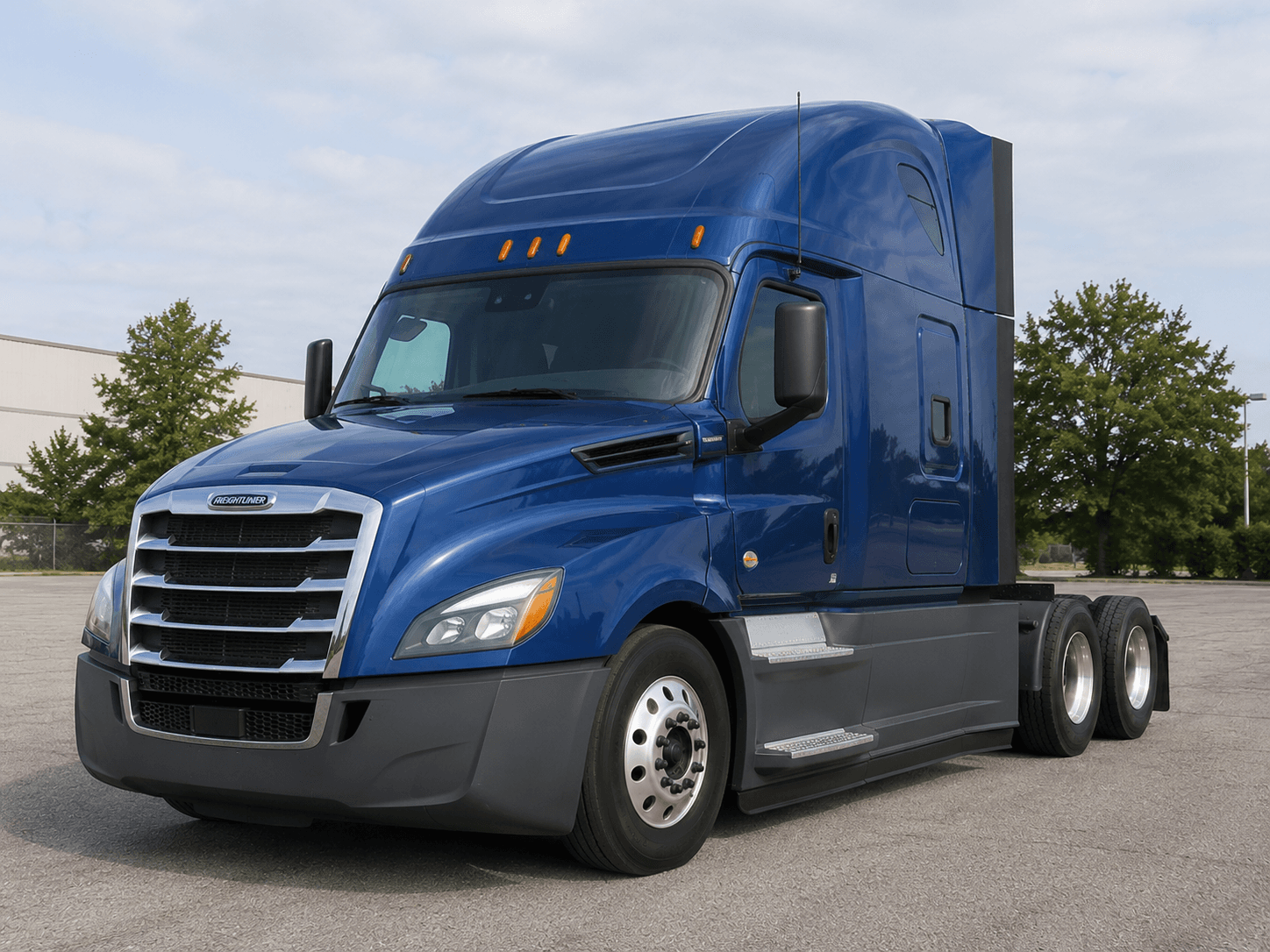 Blue Freightliner sleeper tractor, three-quarter front view